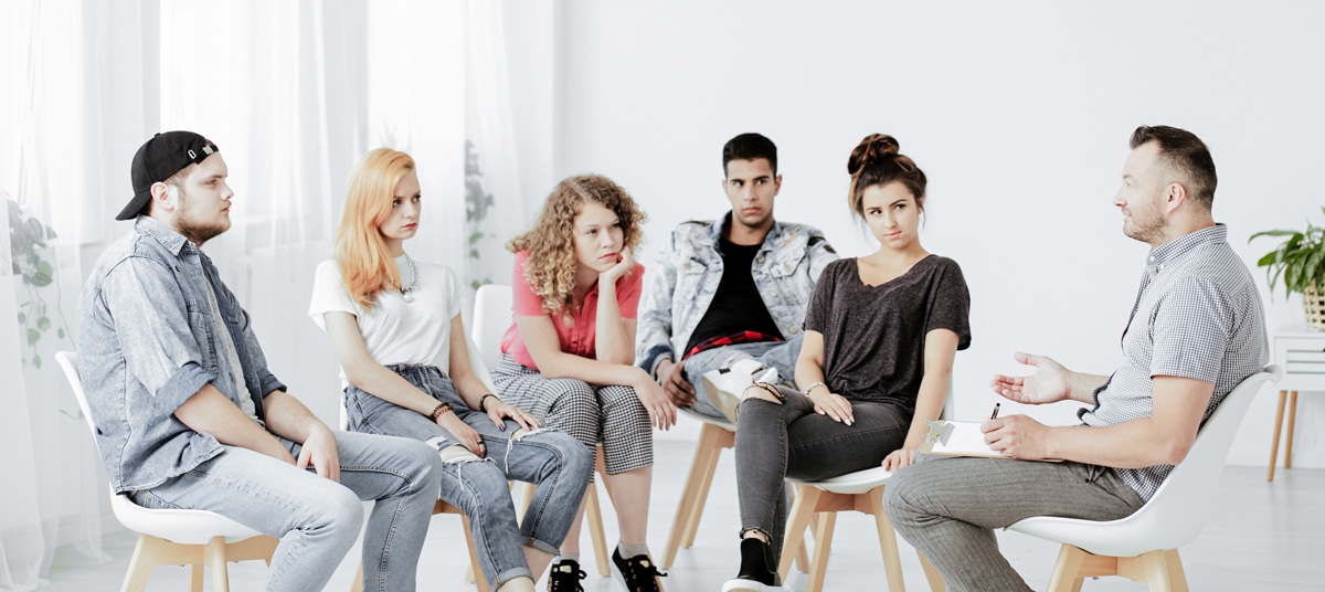 Group of people having addiction therapy services