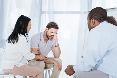 Counselor helping an individual recover from their dependence on alcohol and drugs