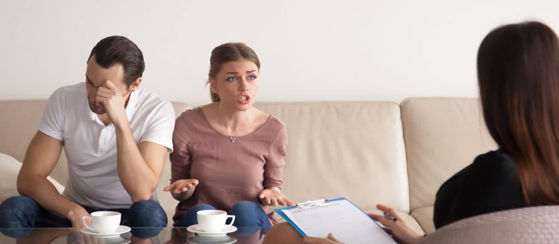 Couple having counselling with a therapist for substance abuse