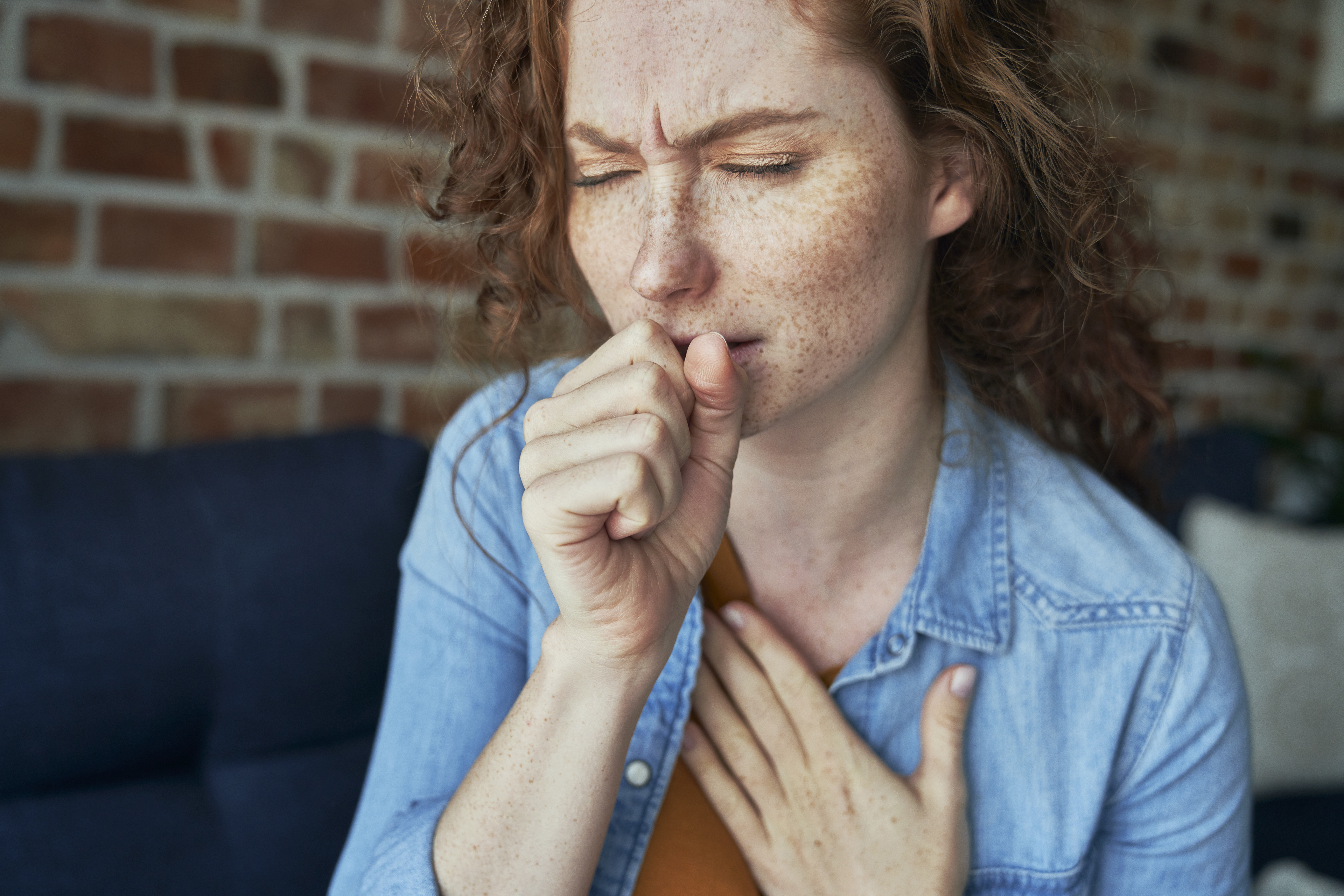 Woman coughing and showing Effects of Drugs on the Lungs